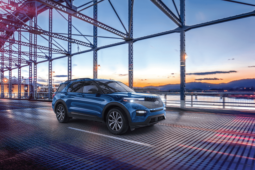 Ford Explorer driving over a steel bridge
