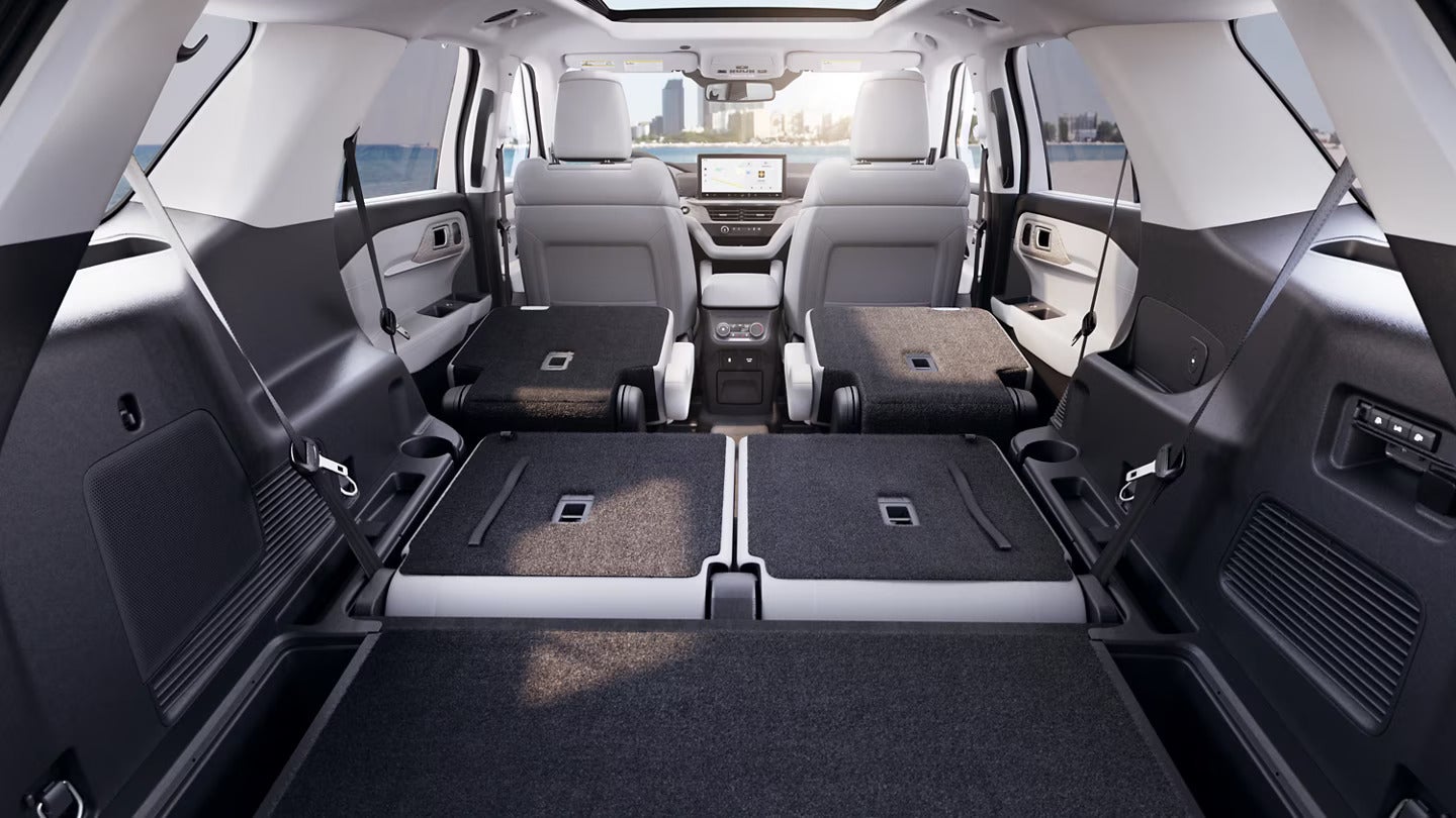 Interior view of the 2025 Ford Explorer with rear seats folded down for expanded cargo space