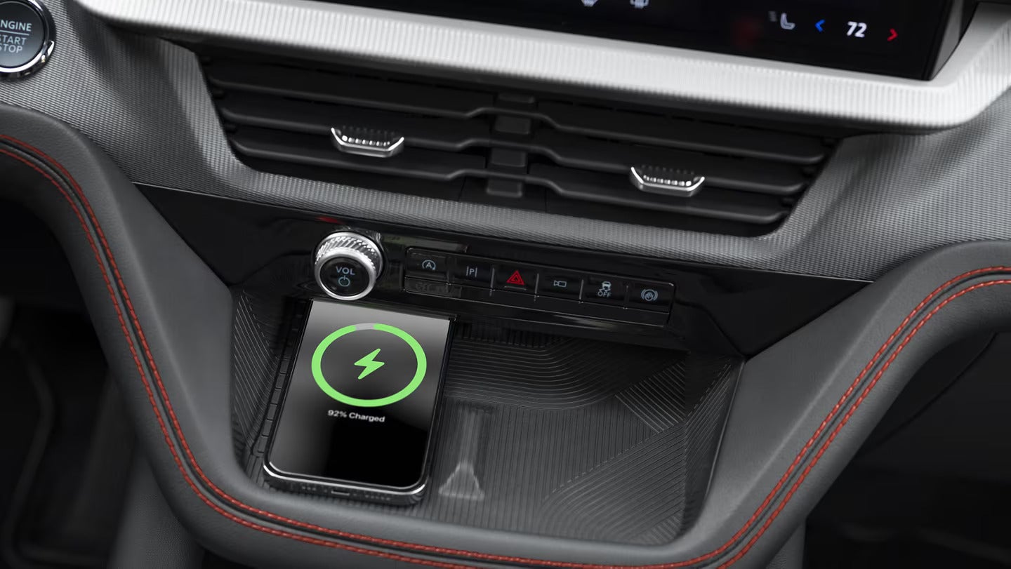 Wireless charging pad with a smartphone inside the 2025 Ford Explorer's center console