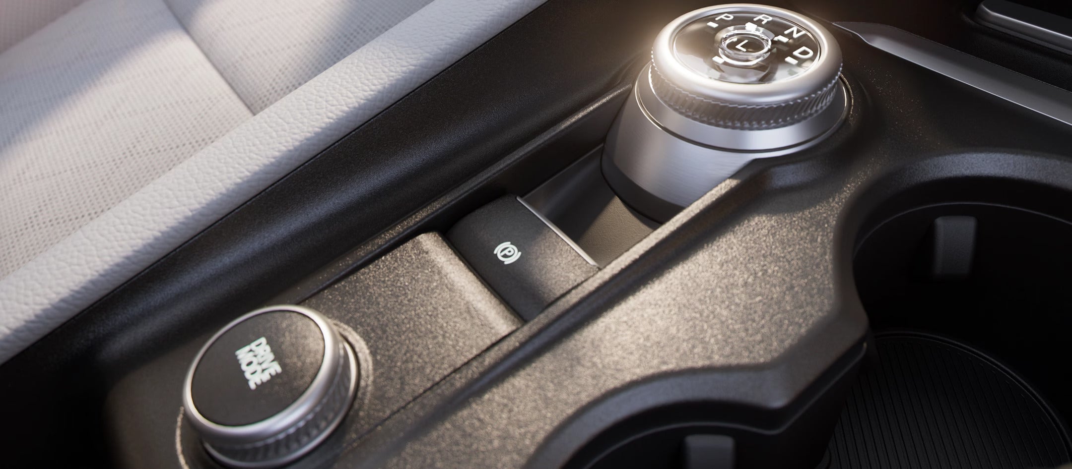 Close-up of the drive mode selector and electronic parking brake in the 2025 Ford Explorer