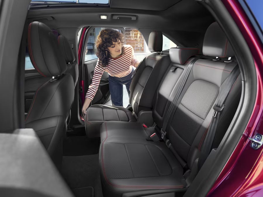 the back passenger seats of a red suv